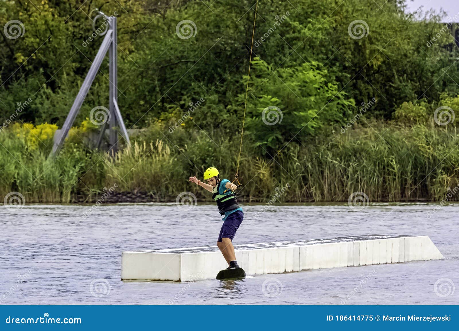 teenager wakeboarding on a lake - brwinow, masovia, poland