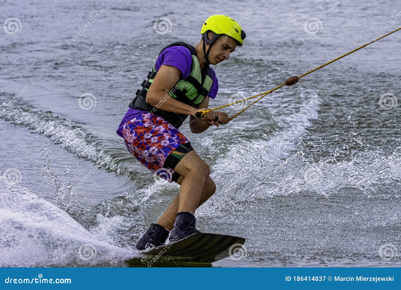 teenager wakeboarding on a lake - brwinow, masovia, poland