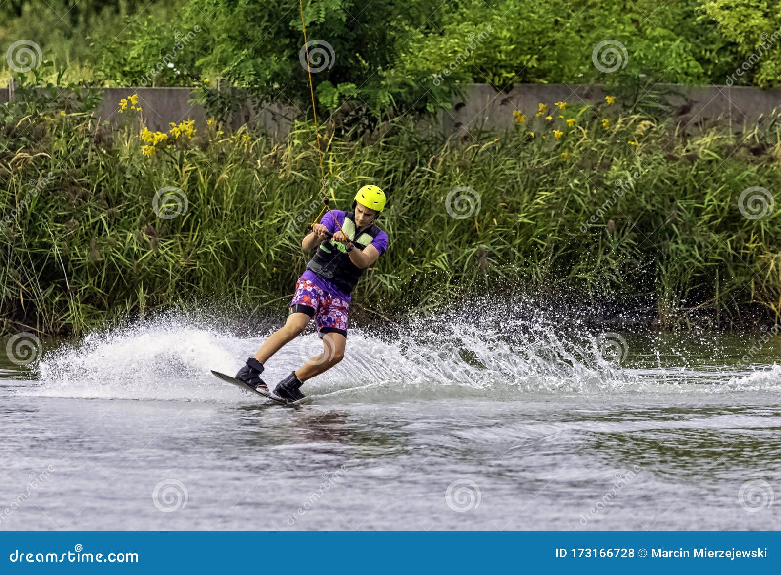 teenager wakeboarding on a lake - brwinow, masovia, poland