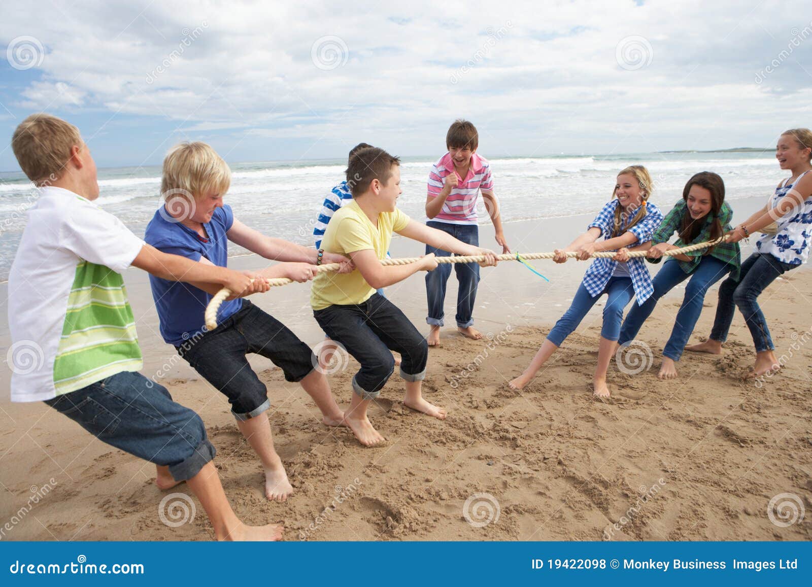 teenagers playing tug of war