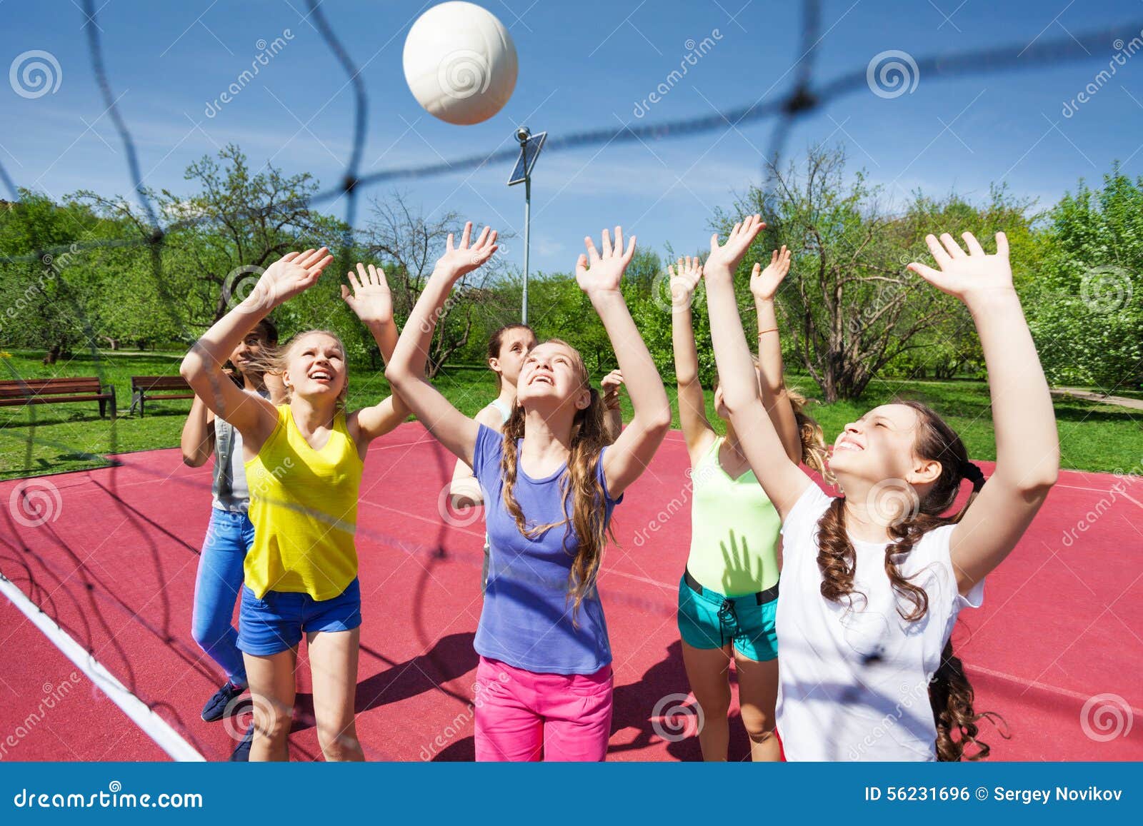 Teenagers Are Playing Volleyball Together Near Net Stock ...