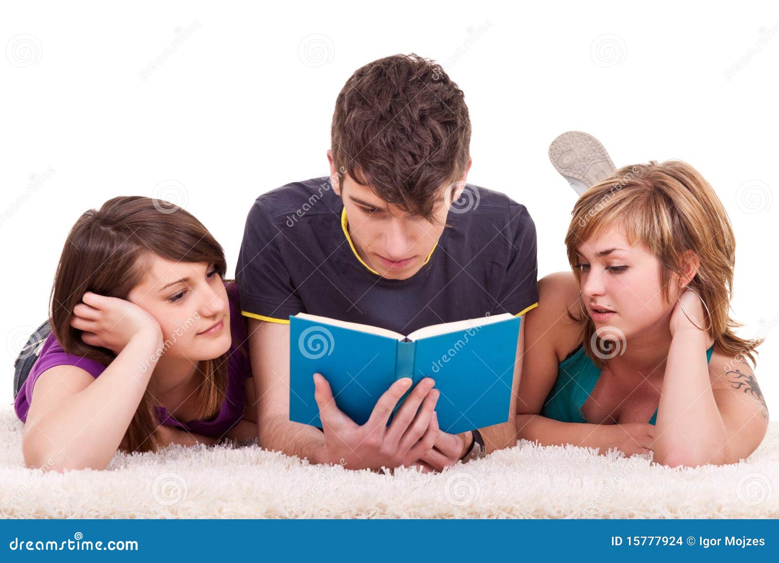 Teenagers reading a book stock photo. Image of reading - 15777924