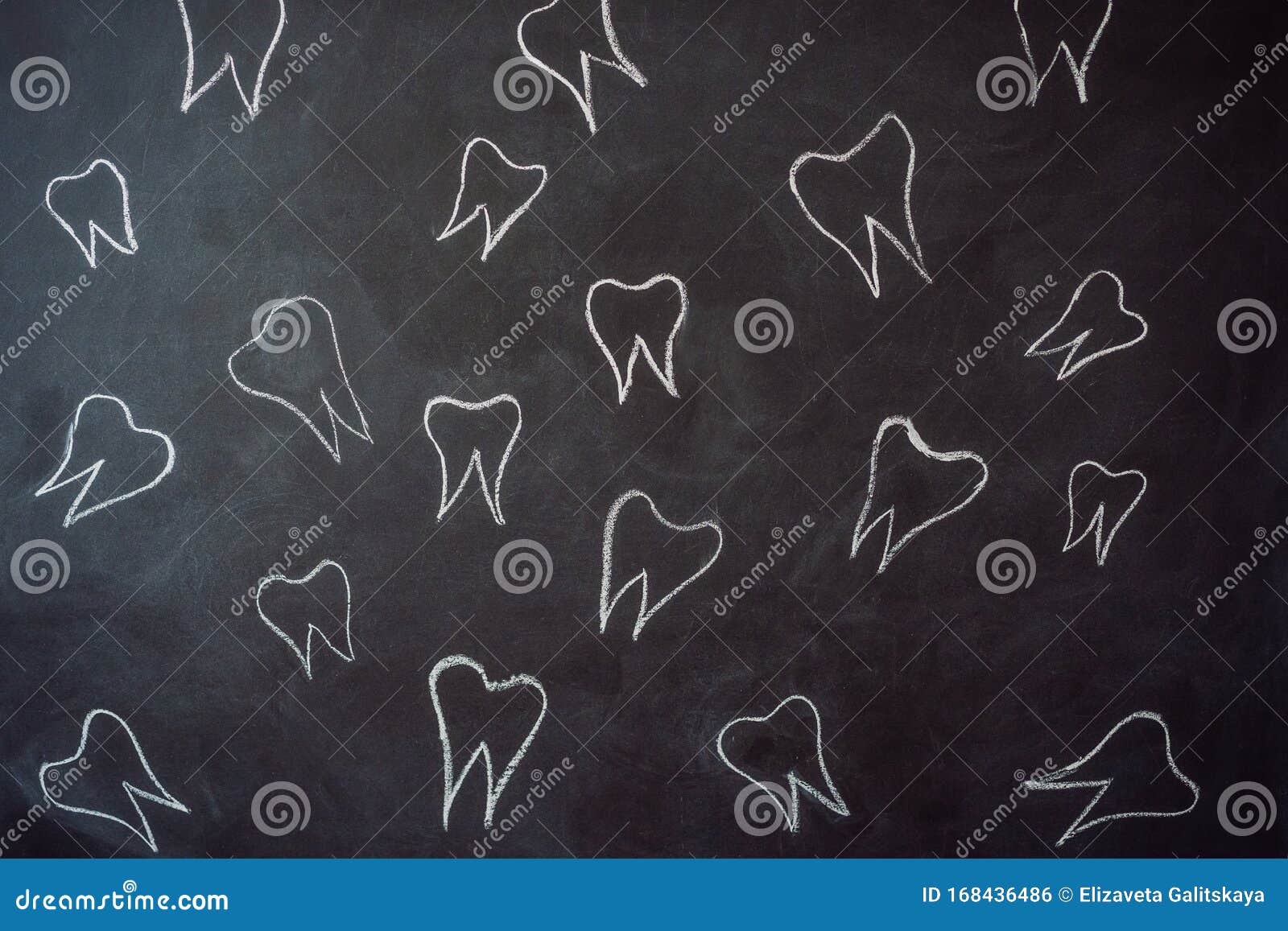 Teeth Drawn in Chalk on a Black Chalkboard. Dentistry Concept Stock
