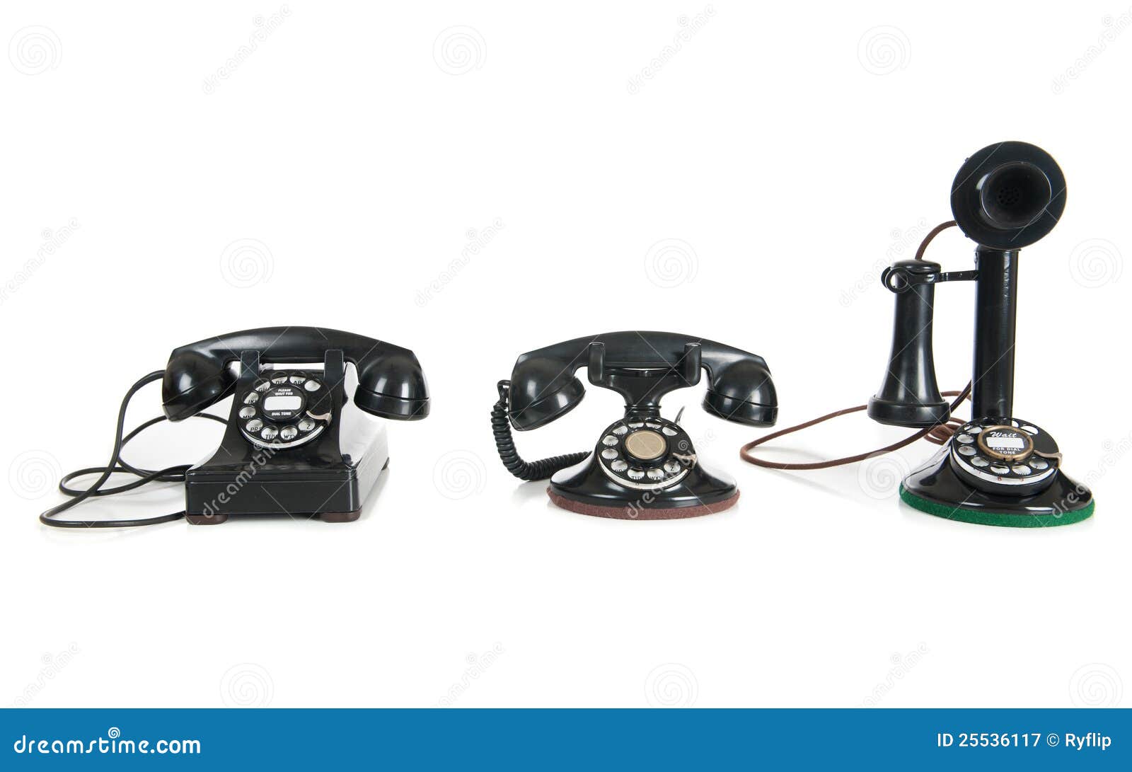 Teléfonos Antiguos Negros En Un Fondo Blanco Imagen de archivo