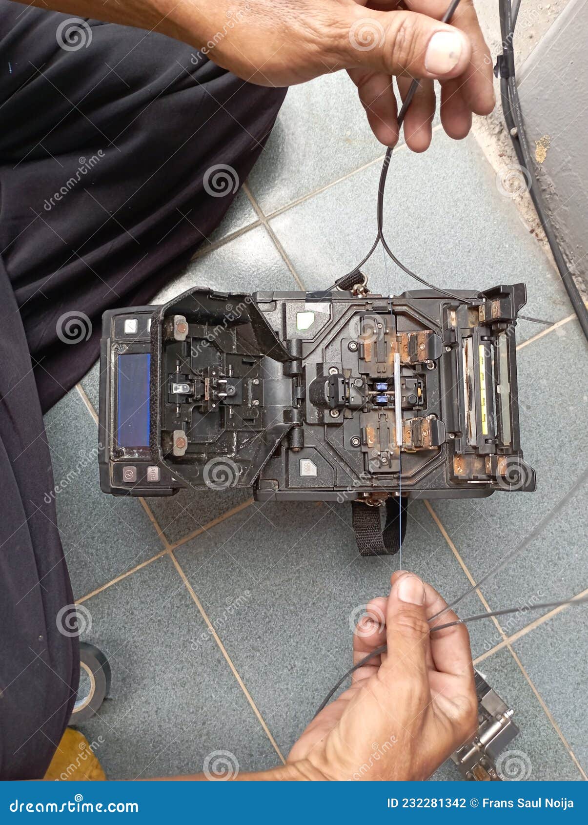 Officer is Connecting Broken Fiber Optic Cable Stock Photo