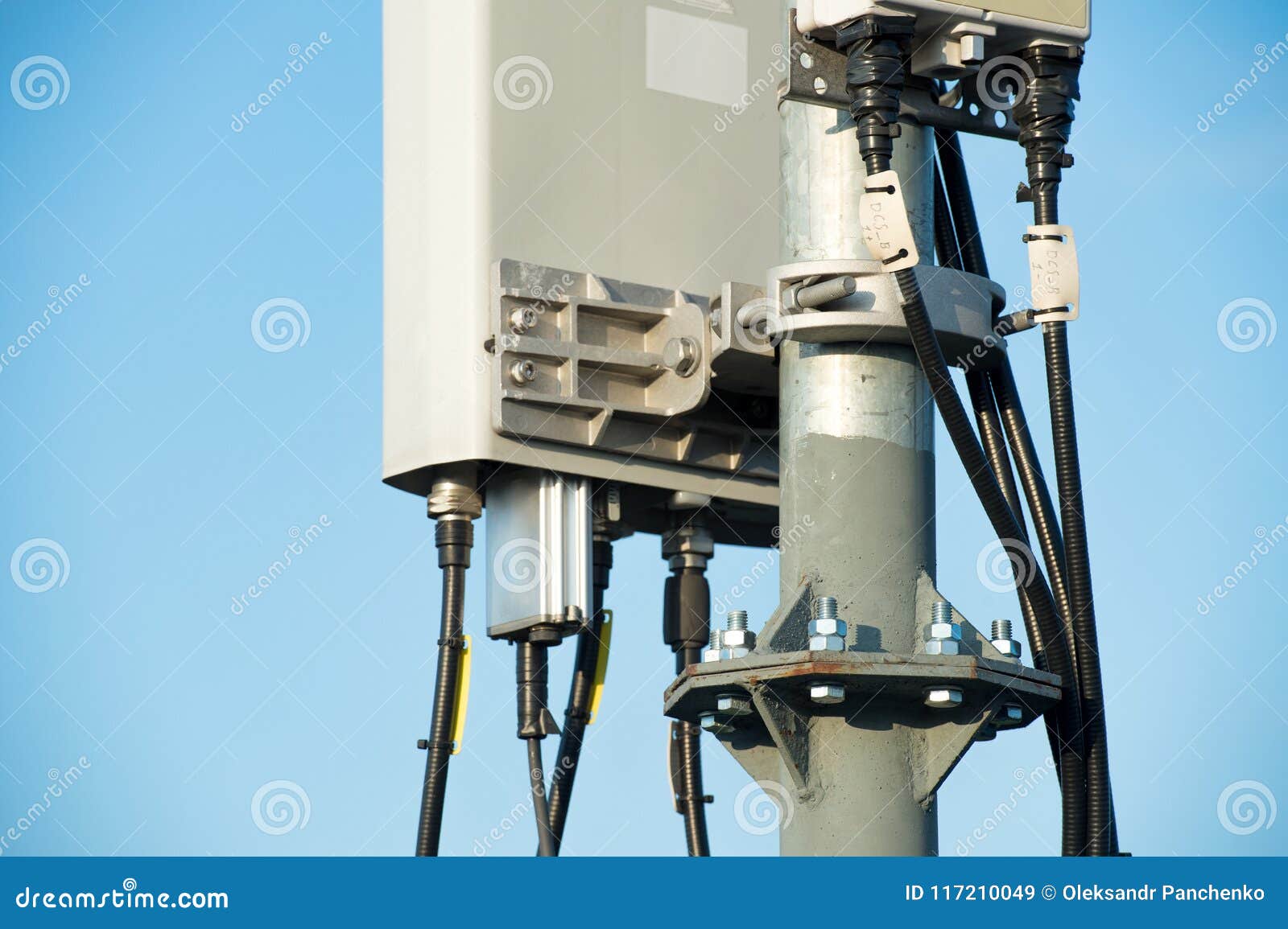 Tower with Sector Antennas Against the Blue Sk Stock