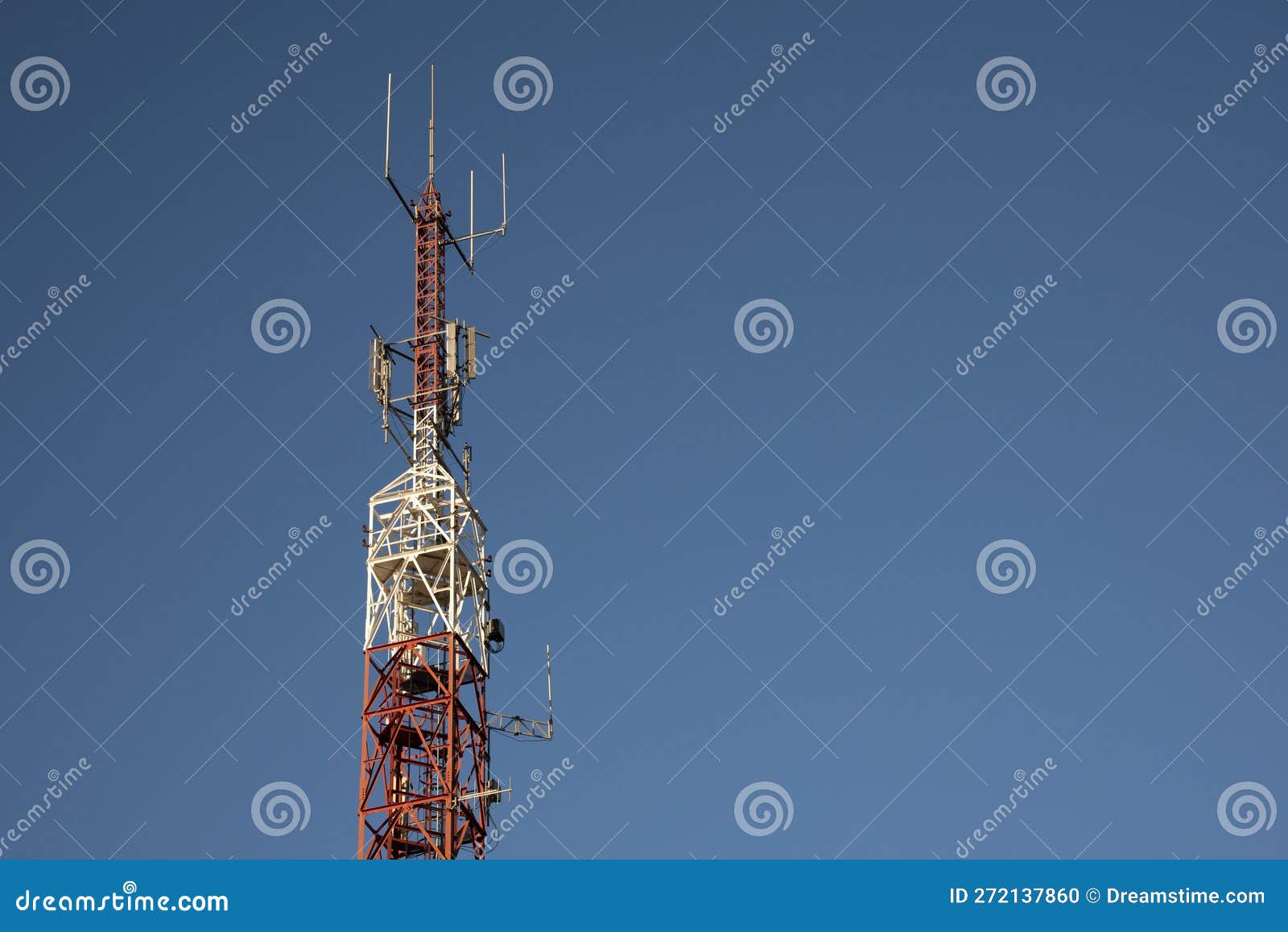 telecommunication towers with blue sky in the background