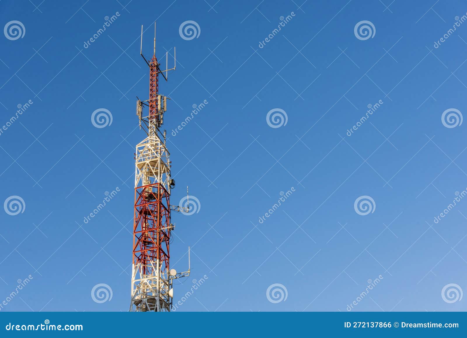 telecommunication towers with blue sky in the background