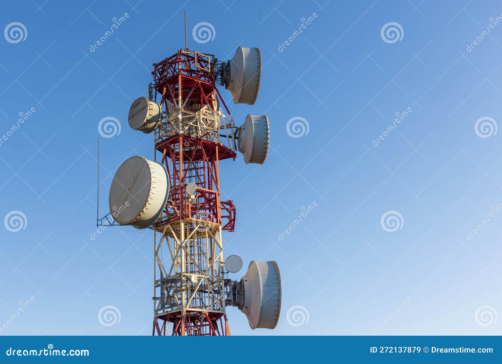 telecommunication towers with blue sky in the background
