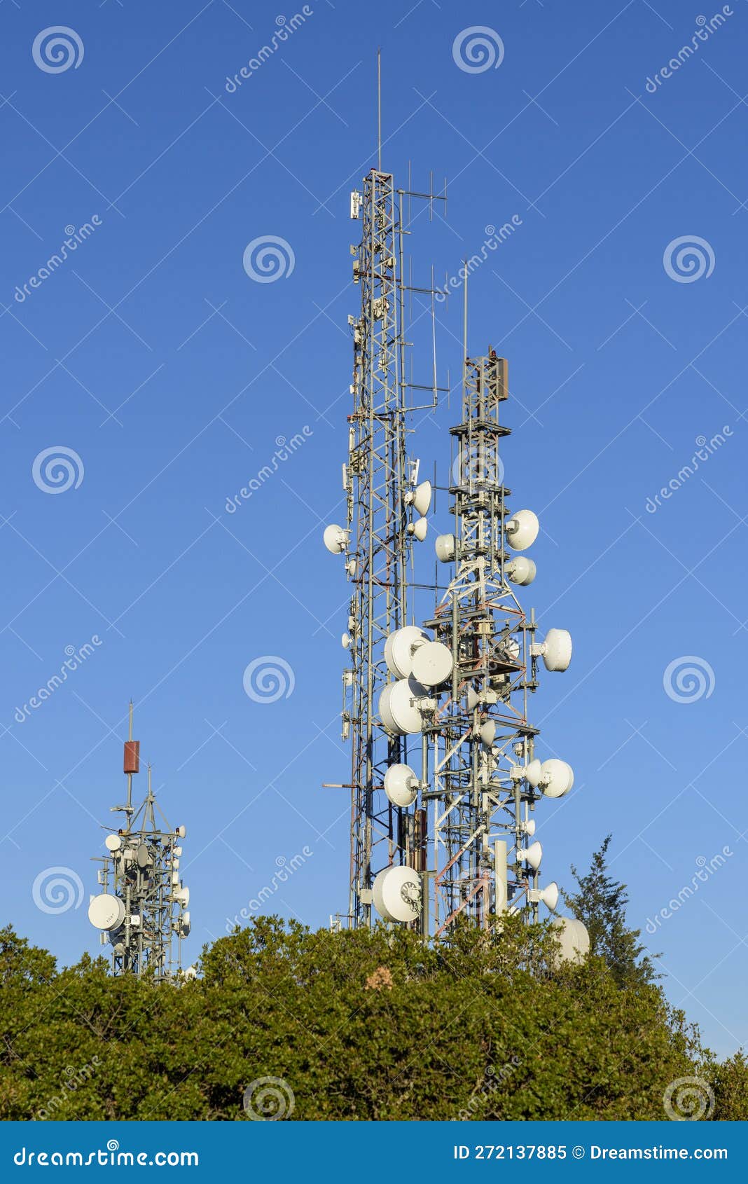 telecommunication towers with blue sky in the background