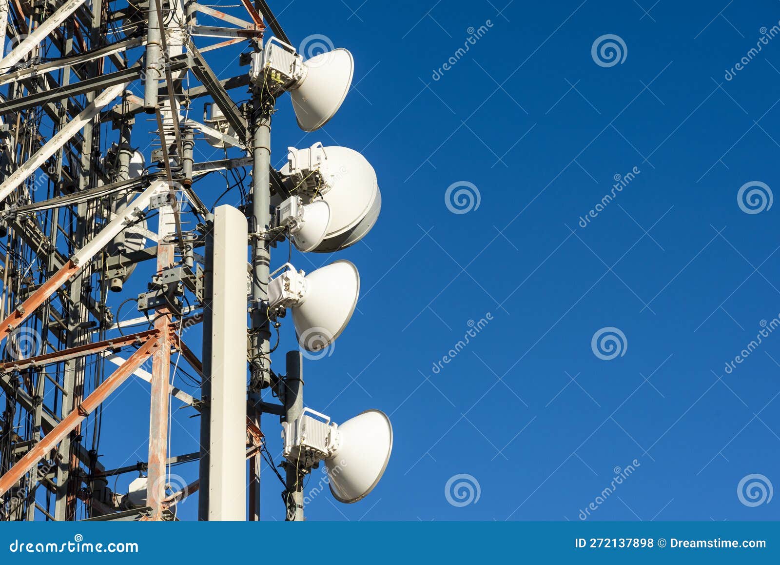 telecommunication towers with blue sky in the background