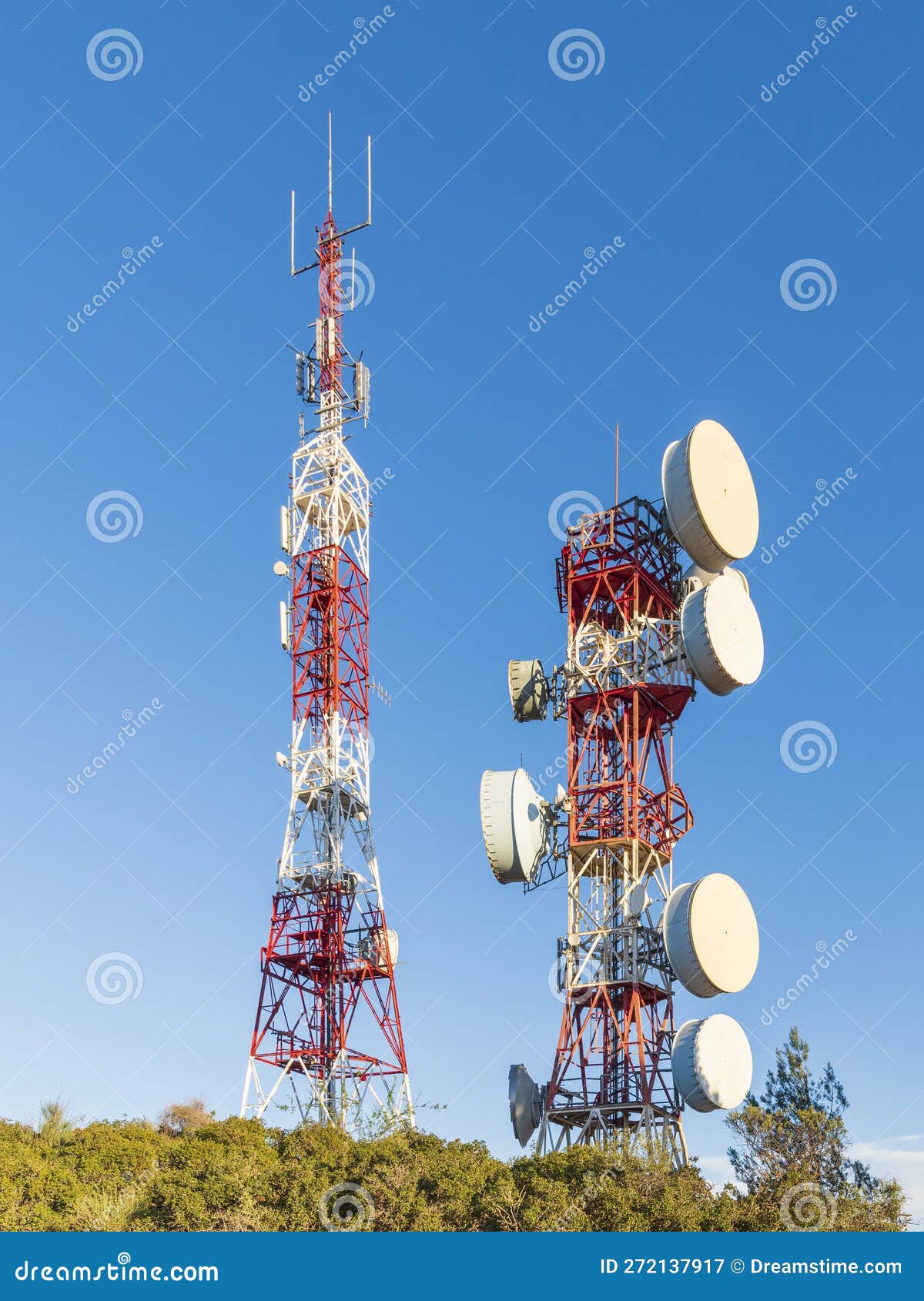 telecommunication towers with blue sky in the background