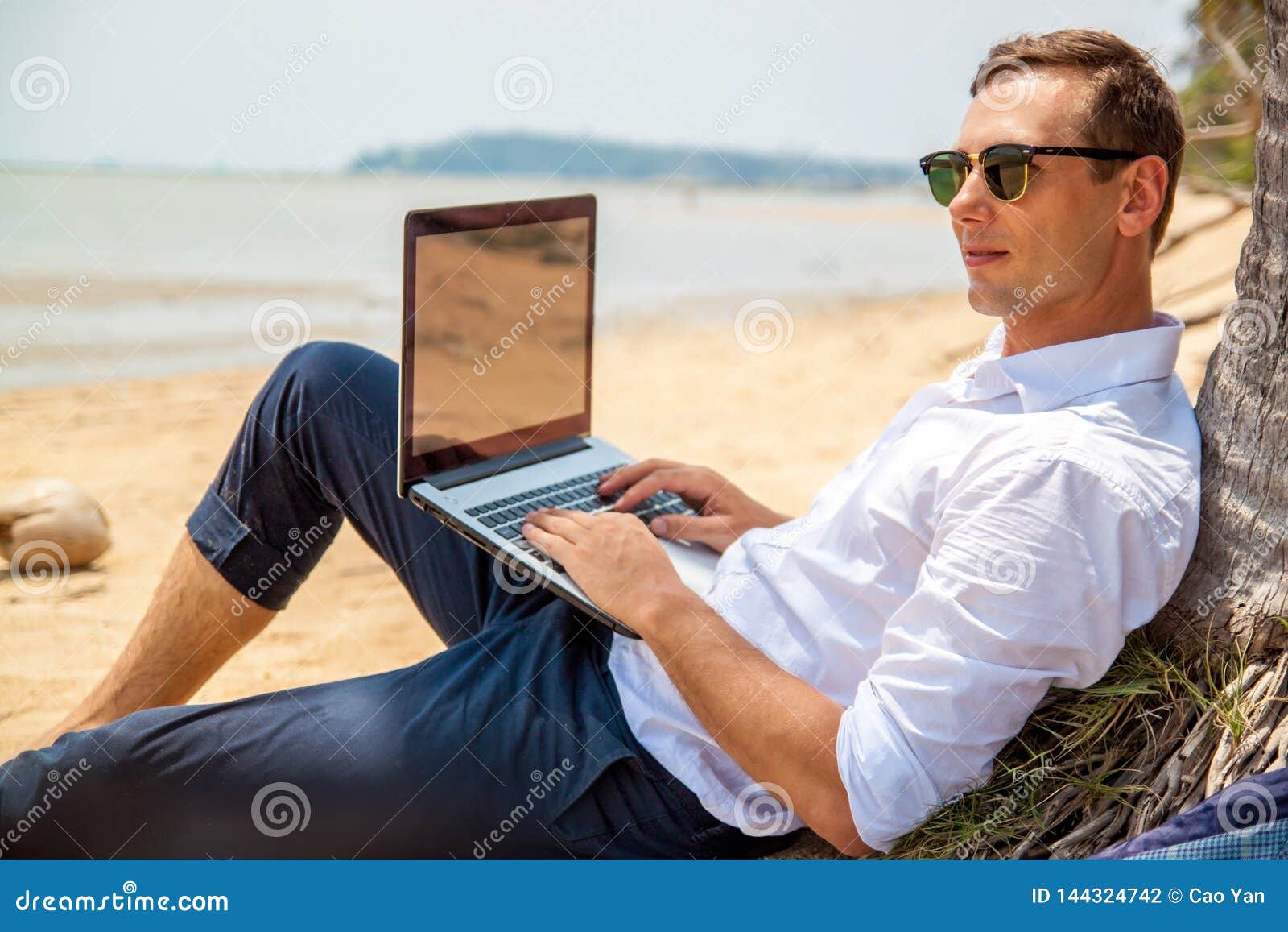 Telecommuting, Businessman Relaxing on the Beach with Laptop and Palm ...