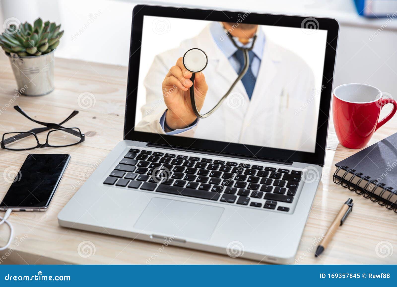 telemedicine concept. doctor gp on a computer screen, office desk background