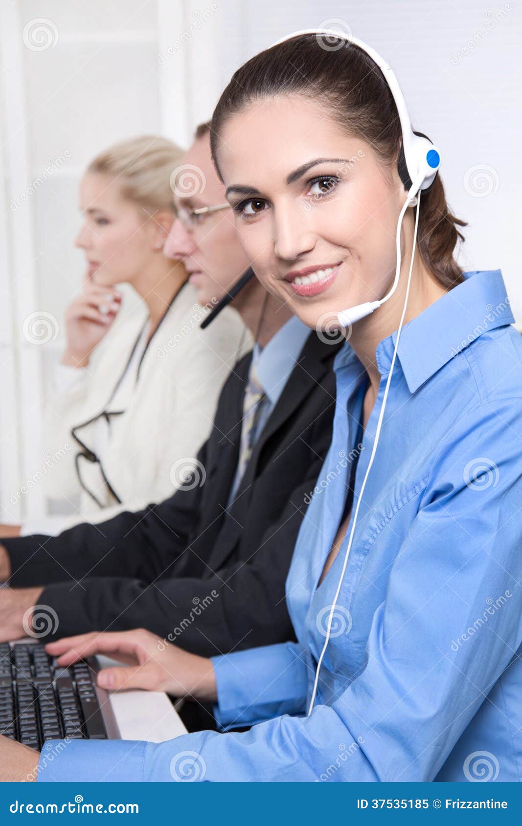 telesales or helpdesk team - helpful woman with headset smiling