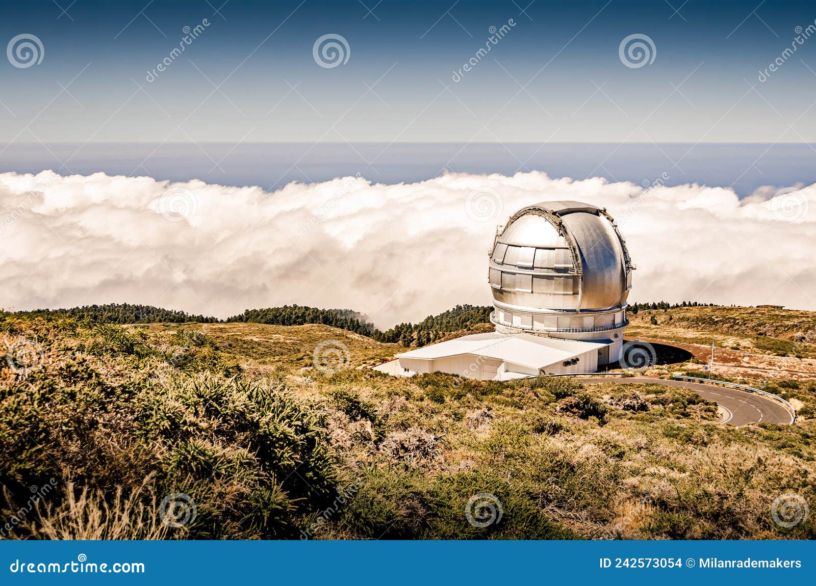 telescope on a mountain. landcape above the clouds. large telescope dome. gran telescopio canarias. roque de los muchachos