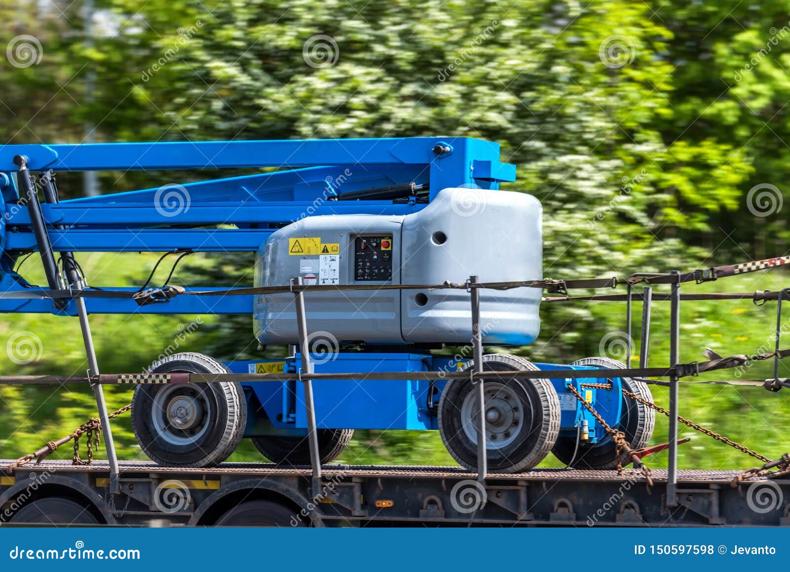 Telescopic Elevator Lifting Equipment in Transporting Progress on Uk Motorway Stock Photo