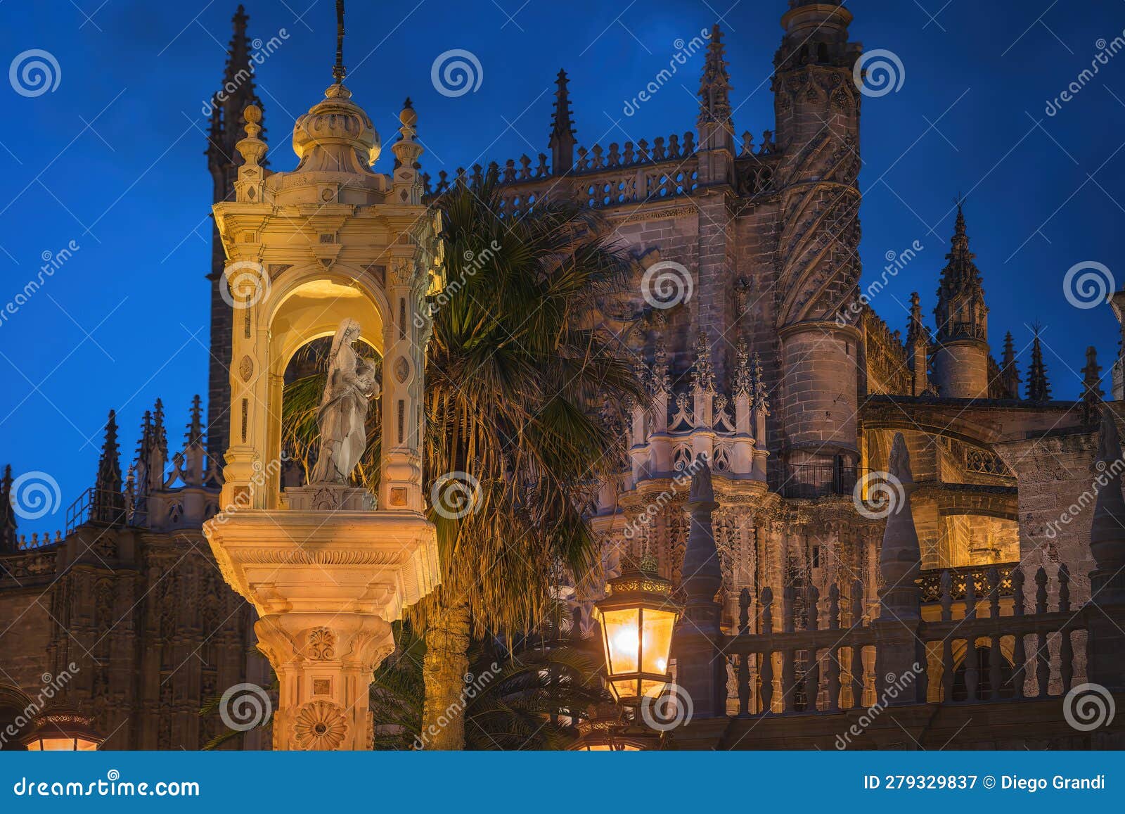 temple of triumph of our lady of patronage at plaza del triunfo square at night - seville, spain