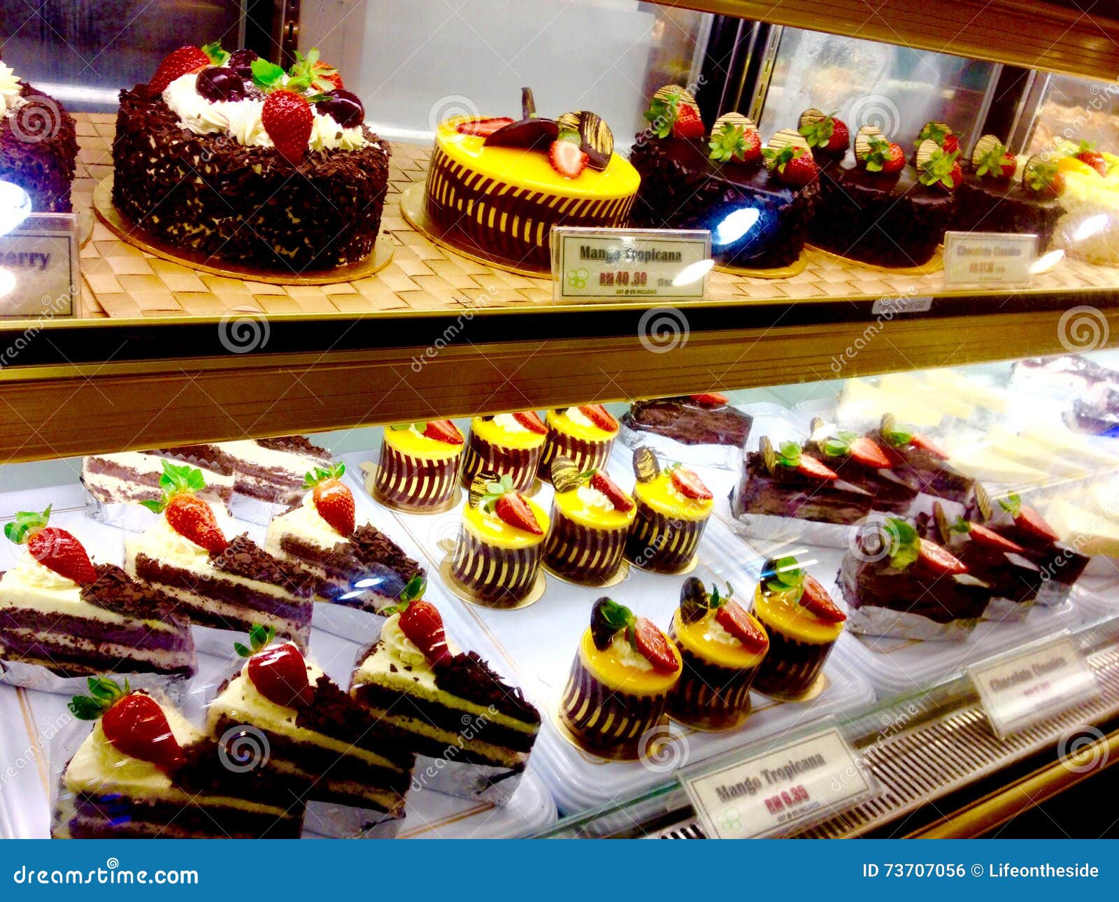 tempting bakery fancy sweet chocolate cakes desserts mango cheesecake & fresh strawberries