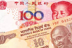 Ten Indian Rupees With One Hundred Chinese Yuan Stock Image Image Of 