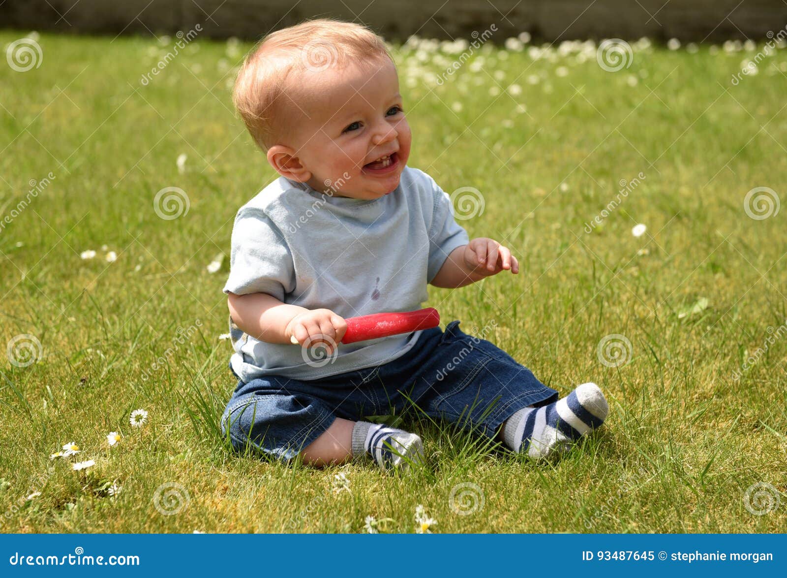 Ten Month Old Baby Boy Eating a Lolly Outdoors Stock Image - Image of ...