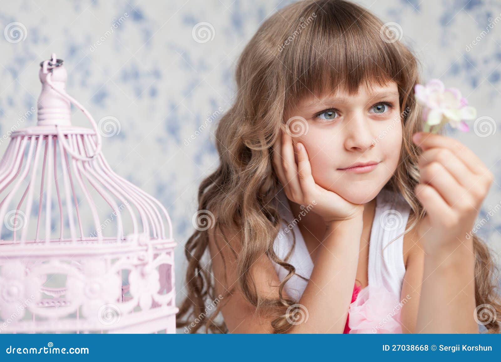 tender dreamy romantic girl looking at flower