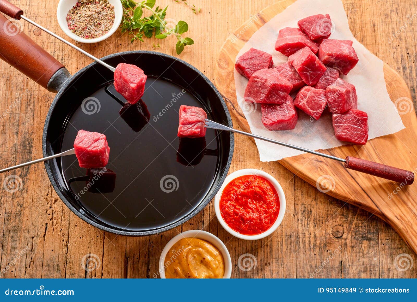 tender prime beef being cooked in a fondue