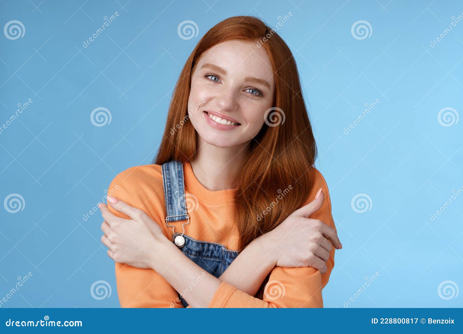 Tender Silly Redhead Girl Standing Blue Background Smiling Joyfully Hugging Arms Crossed Body 