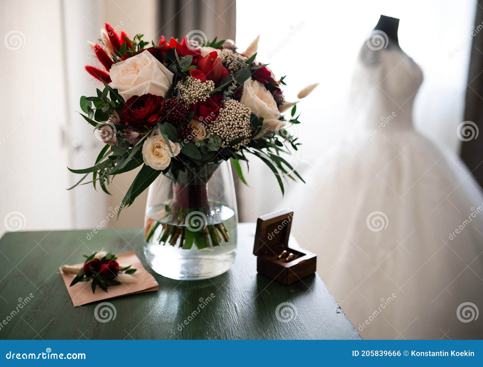 tender weddingday. wedding bouquet and blurred wedding dress