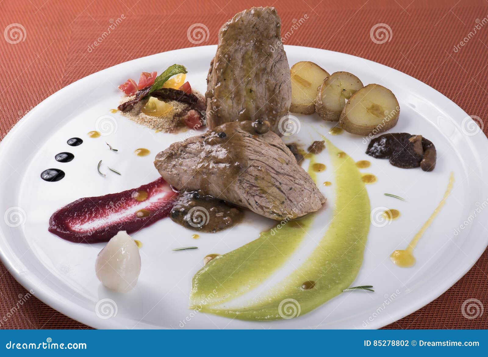 tenderloin with pepper sauce,poached potatoes and two different vegetable puree 2