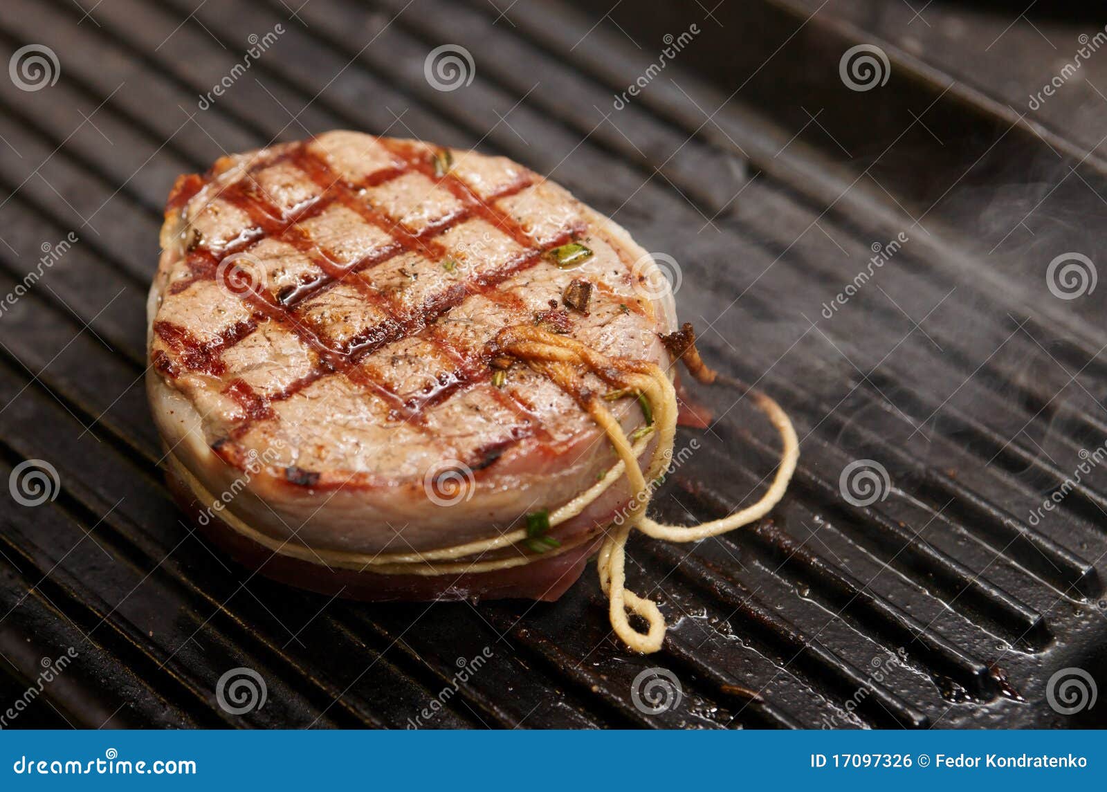 Tenderloin steak on grill stock photo. Image of wrapped 17097326
