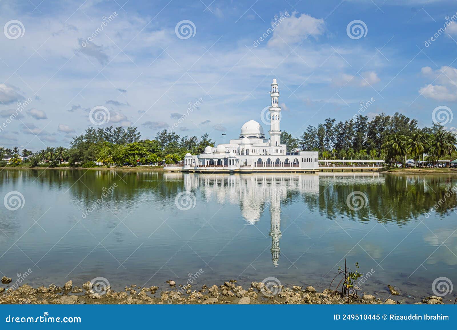 kuala ibai floating mosque or formally named as tengku tengah zaharah mosque and it`s reflection in water at terengganu, malaysia.