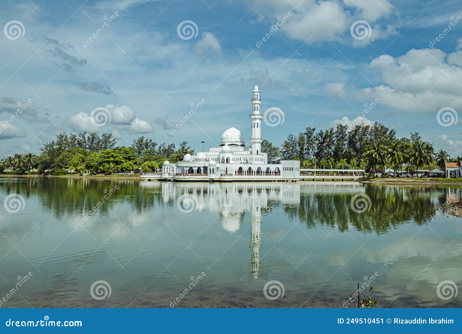 kuala ibai floating mosque or formally named as tengku tengah zaharah mosque and it`s reflection in water at terengganu, malaysia.
