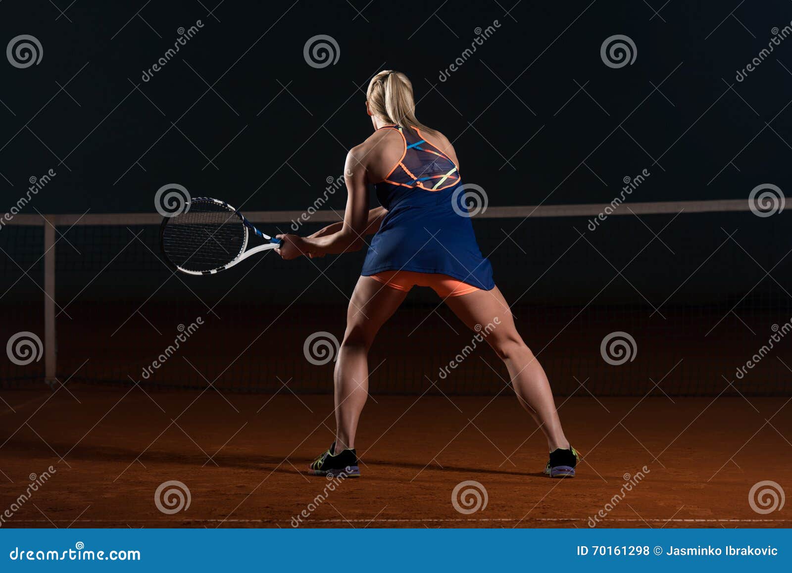 tennis player hitting the ball on tennis court