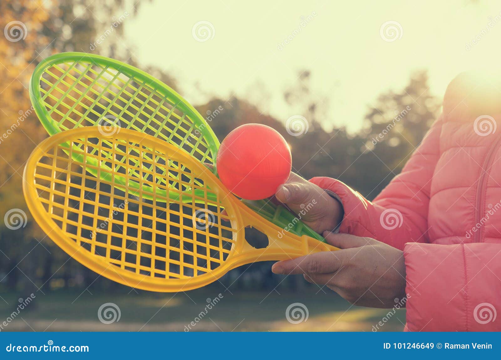 A Tennis Racket in His Hand Catches the Ball in Motion. Stock Image