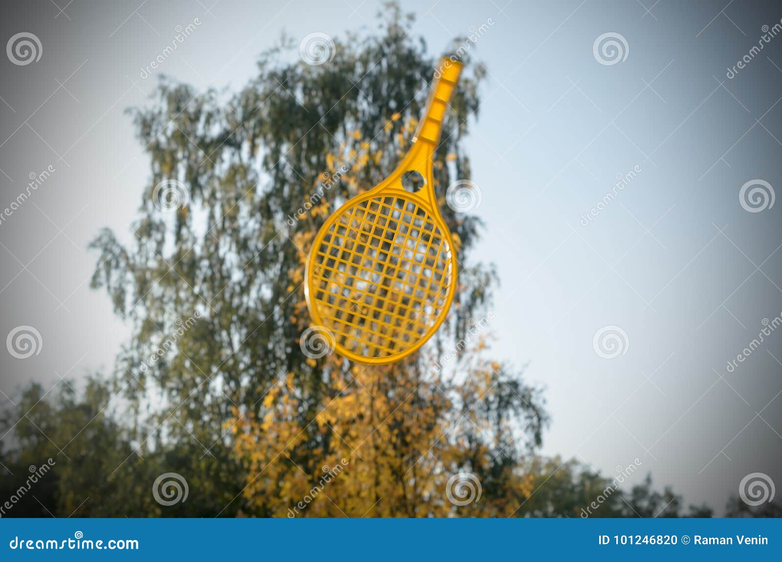 A Tennis Racket in His Hand Catches the Ball in Motion. Stock Photo