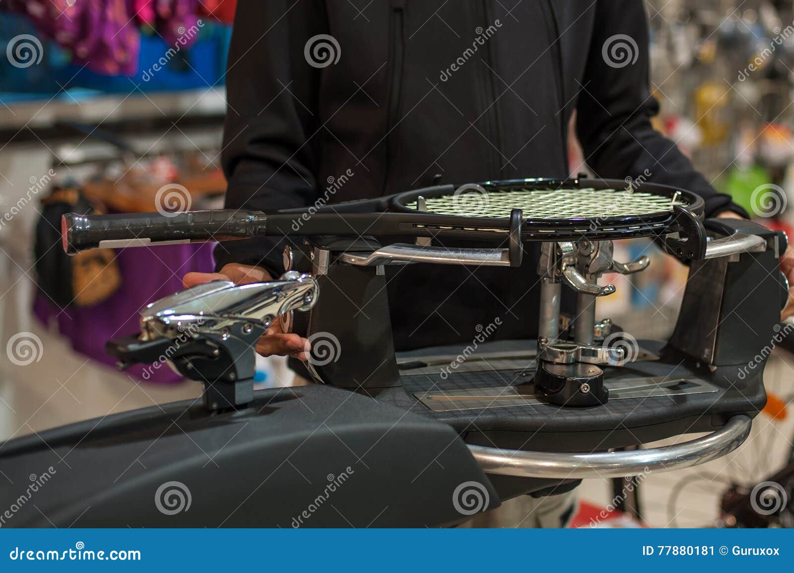 tennis stringer doing racket stringing