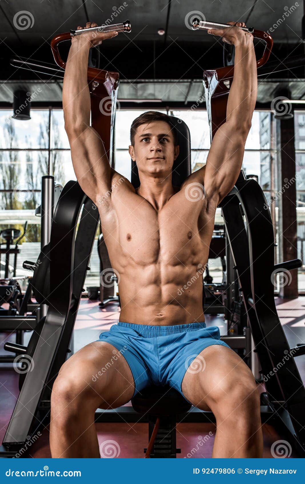Tense Muscles of Hands Under Load. Man Doing Exercise for Biceps in the