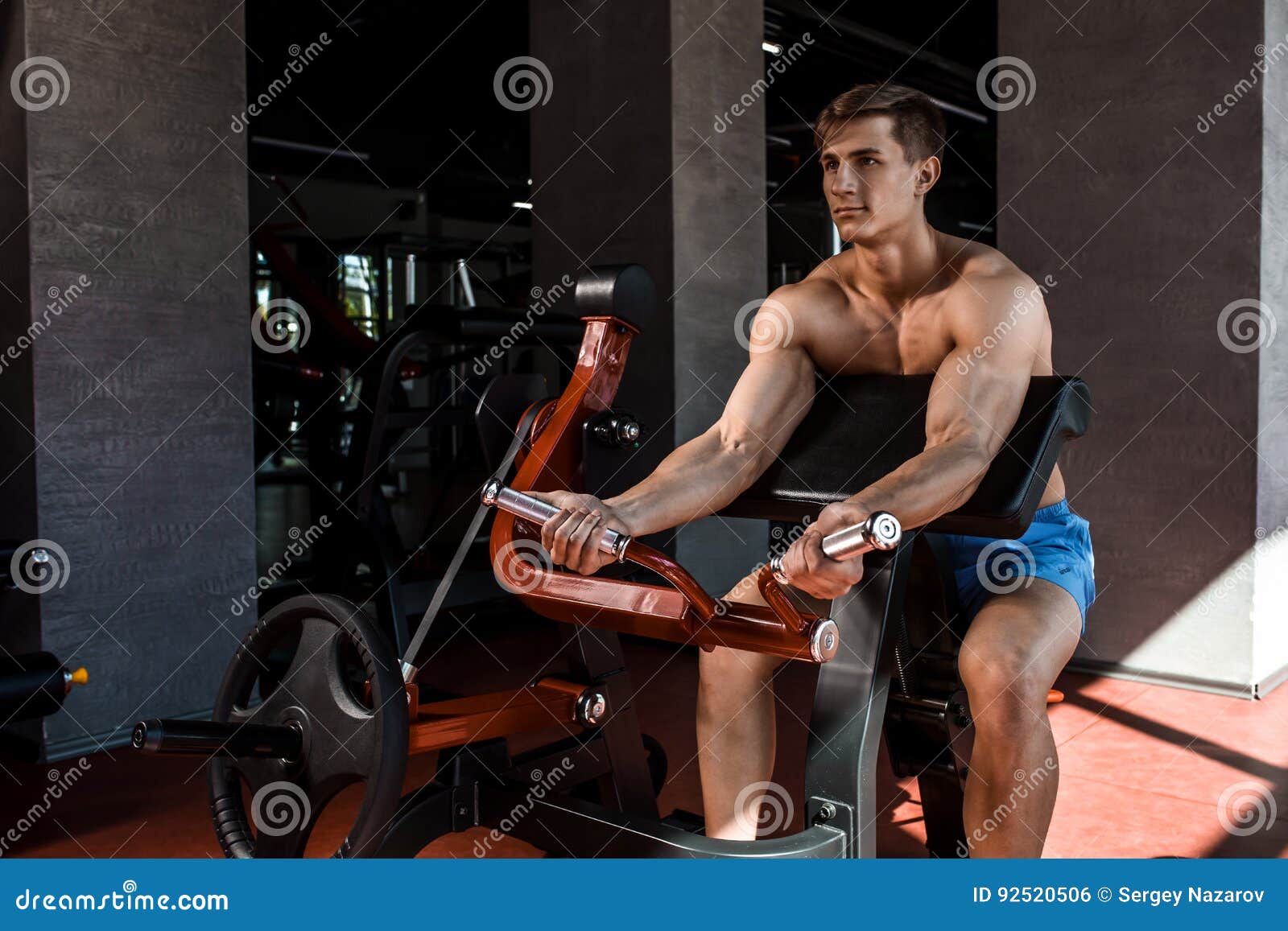 Tense Muscles of Hands Under Load. Man Doing Exercise for Biceps in the