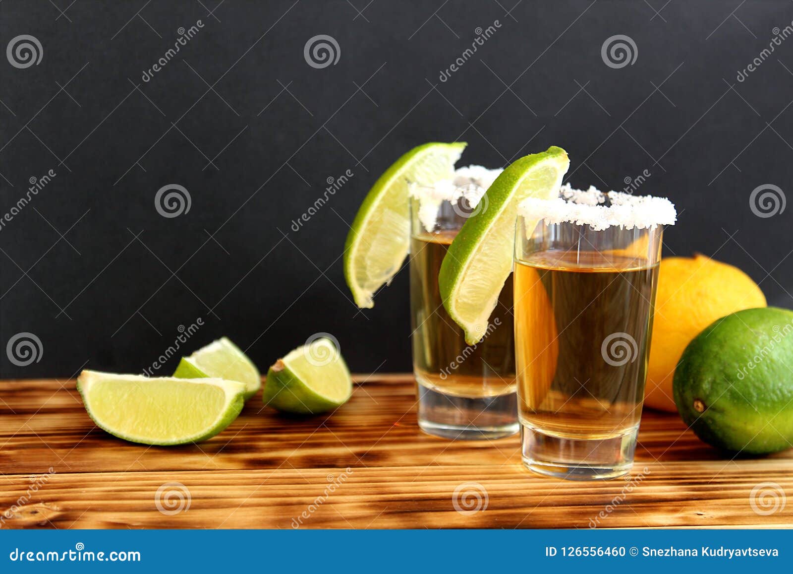 Two Glasses of Tequila with Lime and Salt Stock Photo - Image of liquid ...