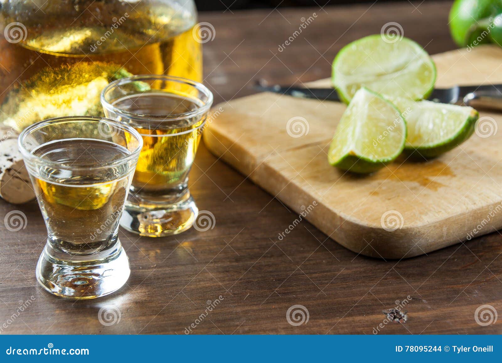 Tequila Shots with Lime Wedges Cut Up for Drinking at a Party. C Stock
