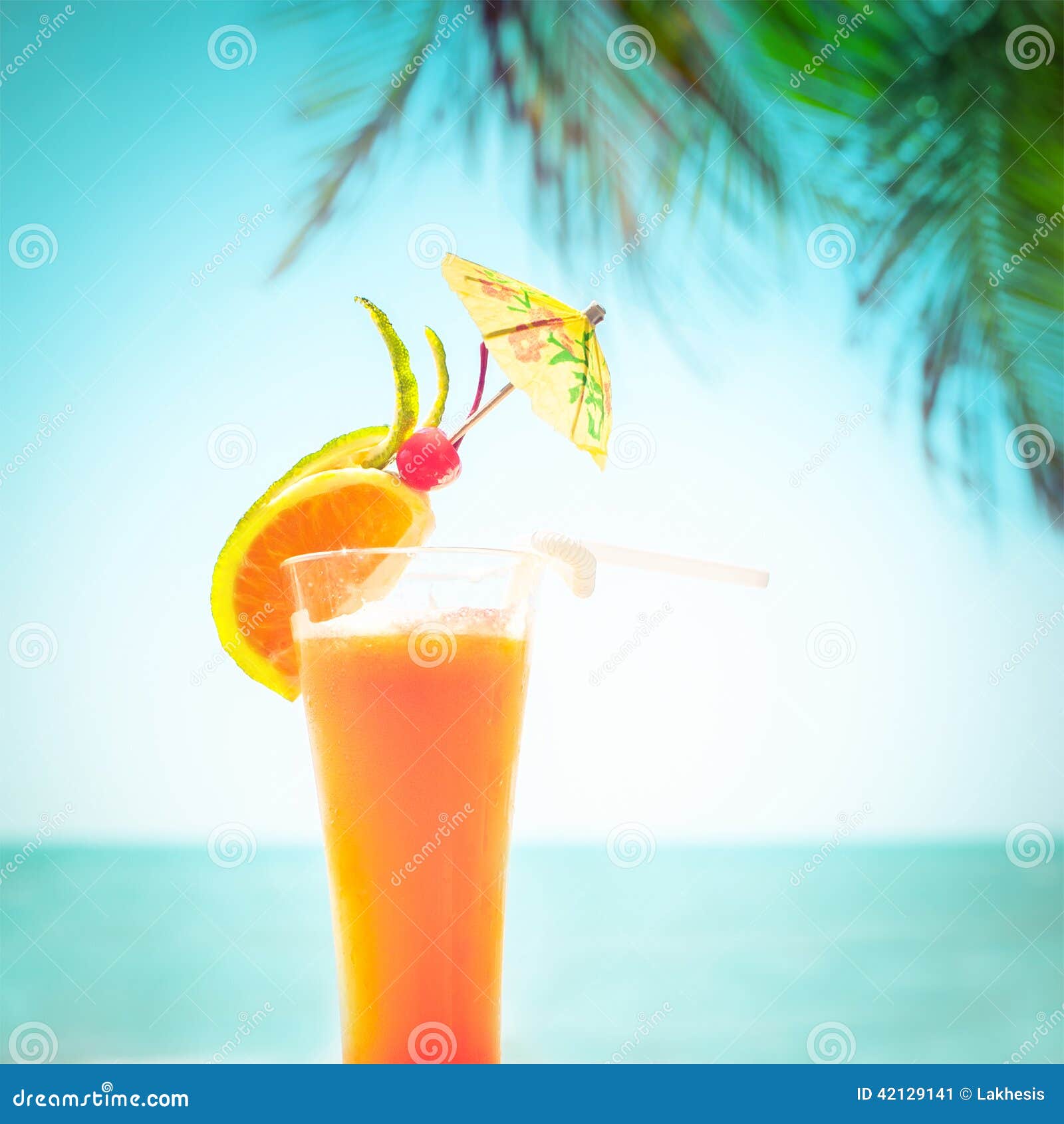 Tequila Sunrise Cocktail With Fruits And Umbrella Decoration Stock