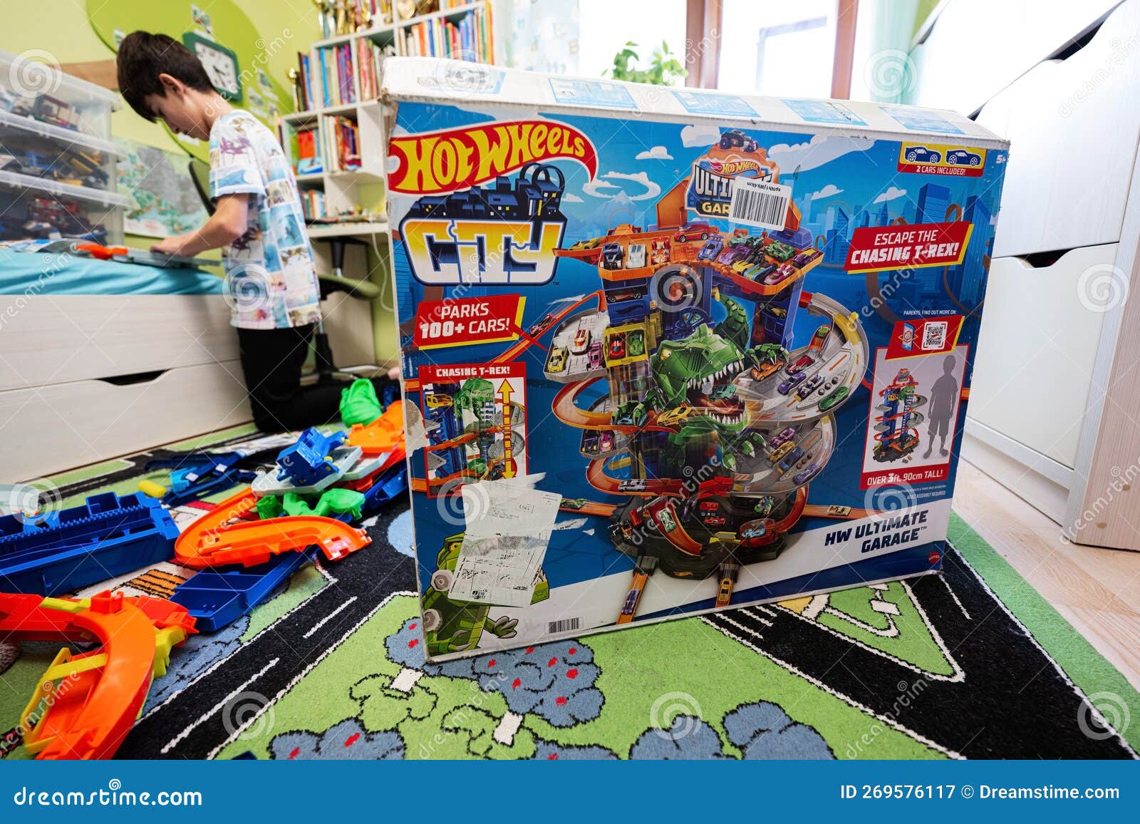 Ternopil, Ukraine - February, 2023: Boy Unboxing Hot Wheels City