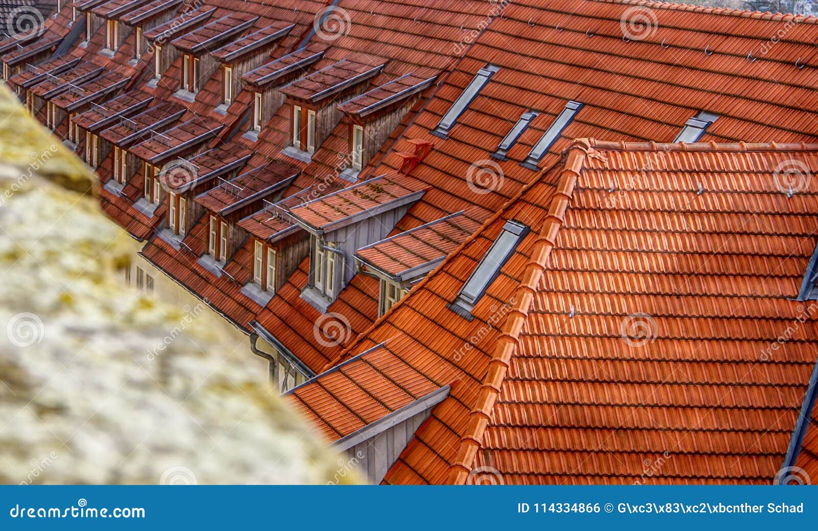 brick roof with dormer windows