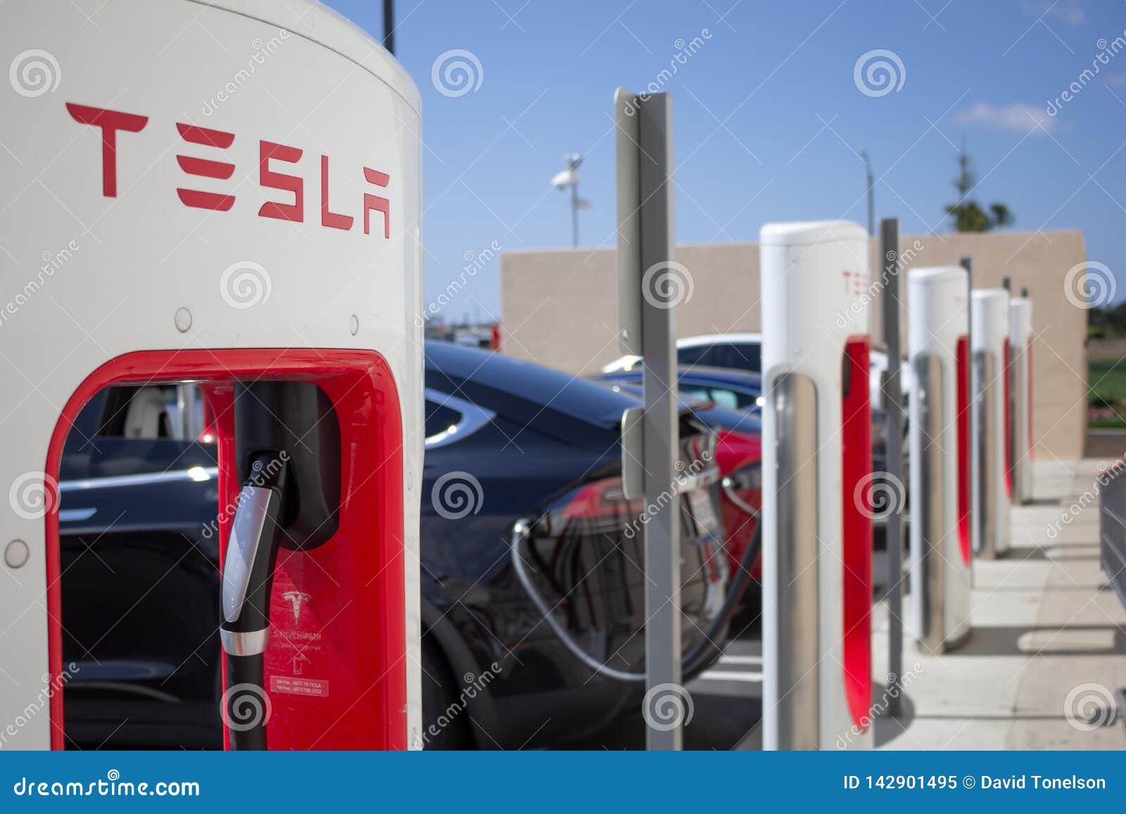 tesla charging station pumps tesla supercharger station pumps tesla vehicles plugged fountain valley california image