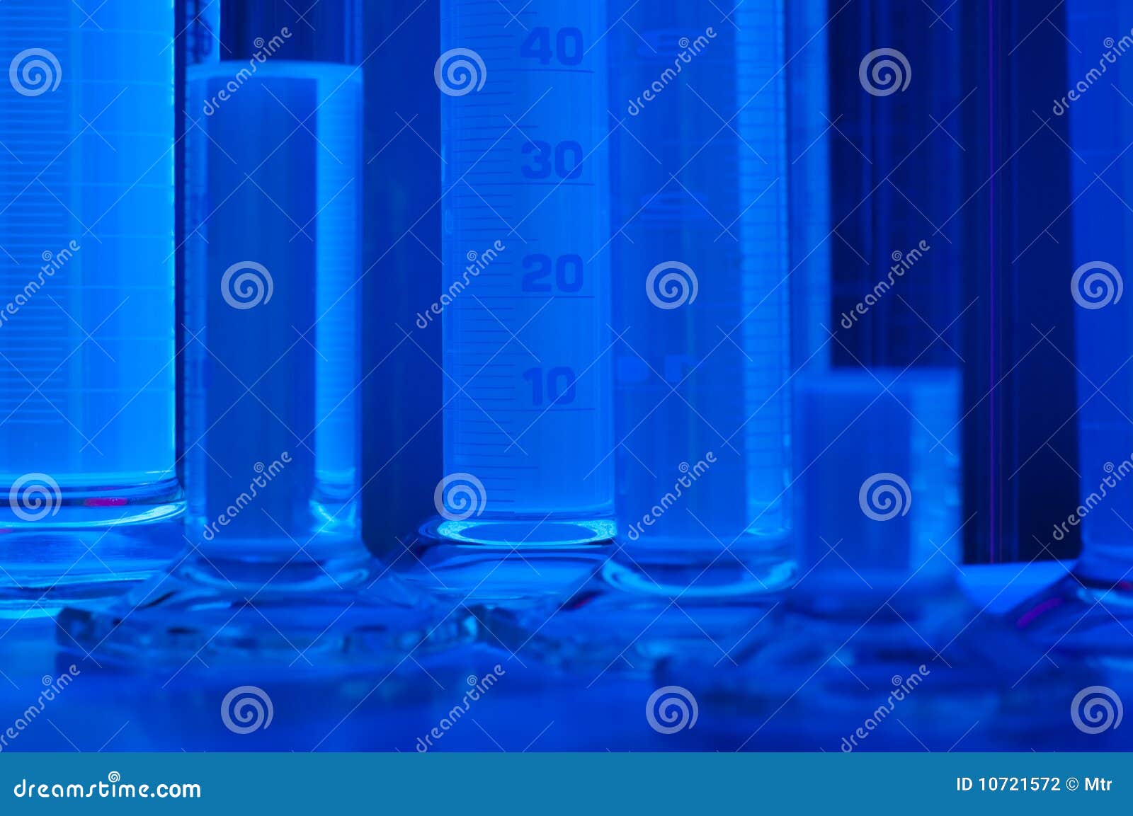 Test tubes in blue light stock photo. Image of chemistry 10721572