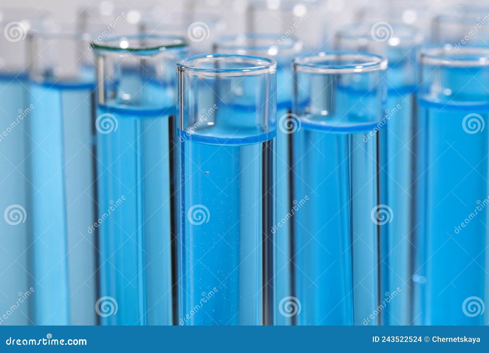 Test Tubes with Light Blue Reagents, Closeup. Laboratory Analysis Stock