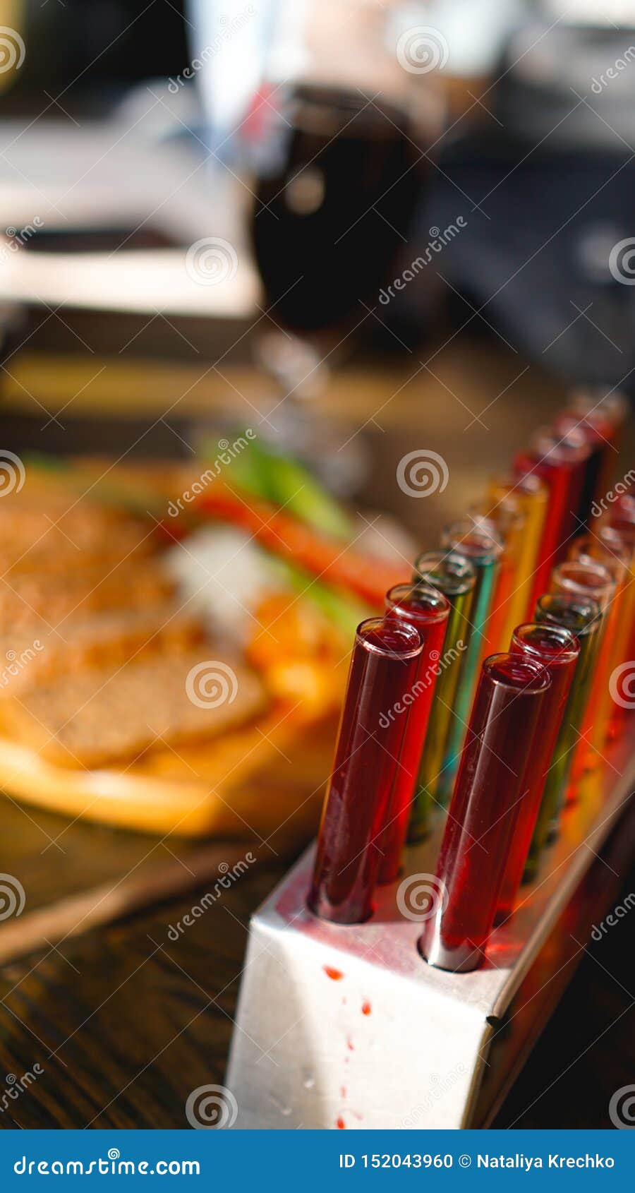 Test Tubes with Multicolored Liquid. Alcohol in Test Tubes Dark Bar