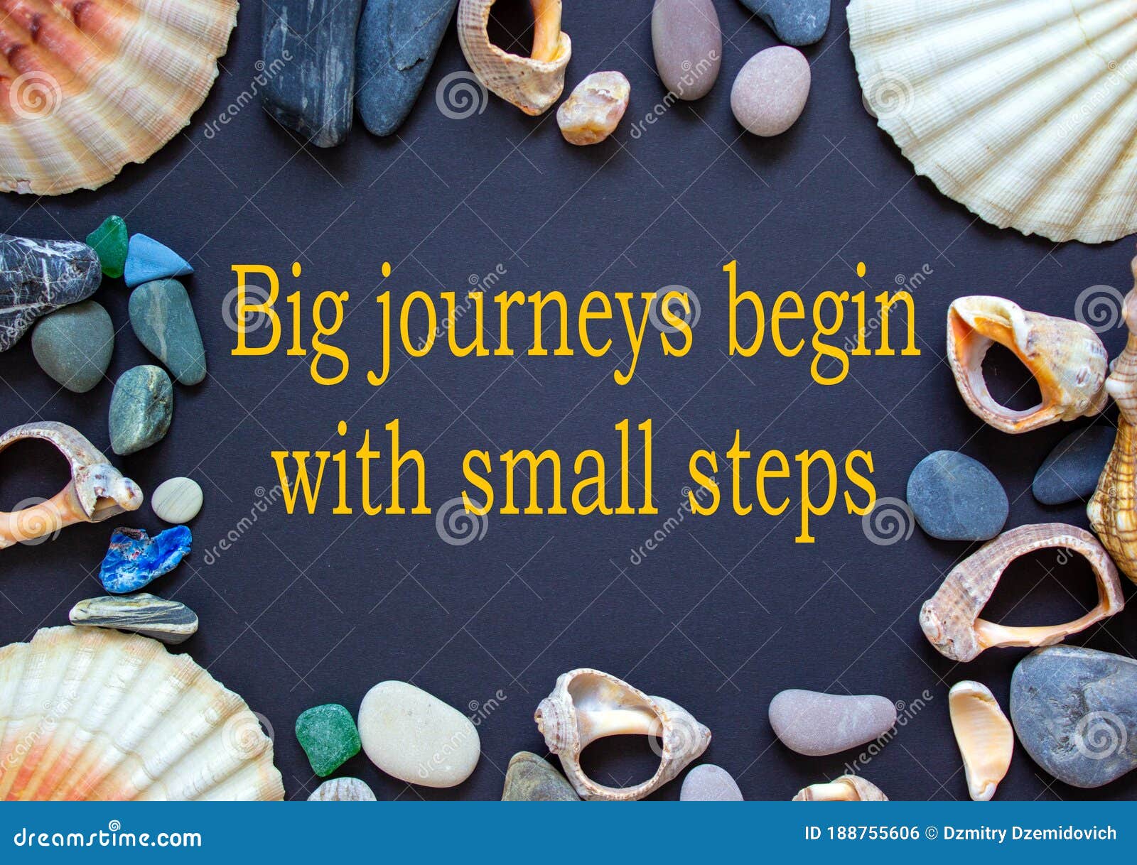 text `big journeys begin with small steps` on a beautiful black background. sea stones and seashells. concept