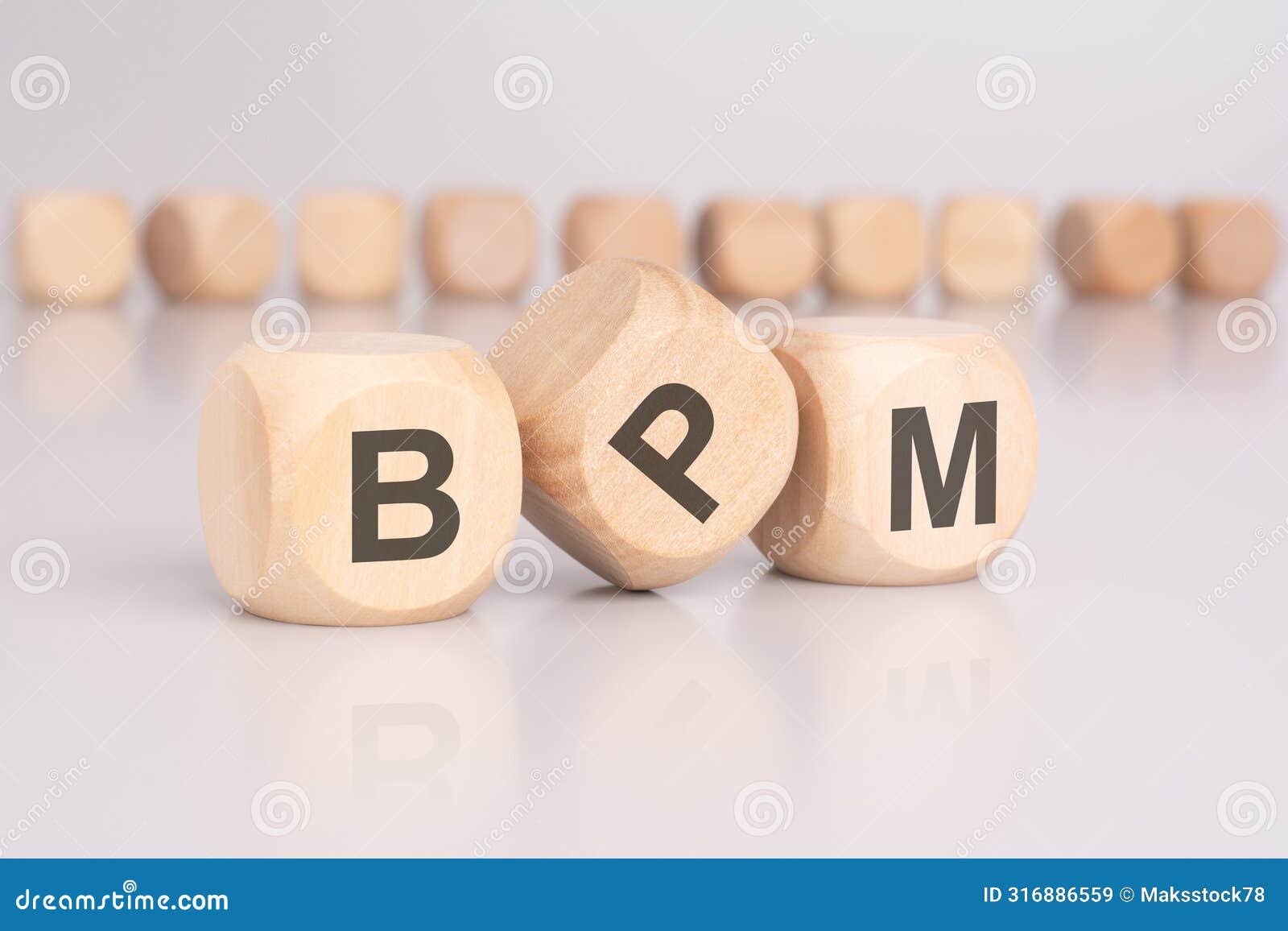 text 'bpm' - business process management - on wooden cubes